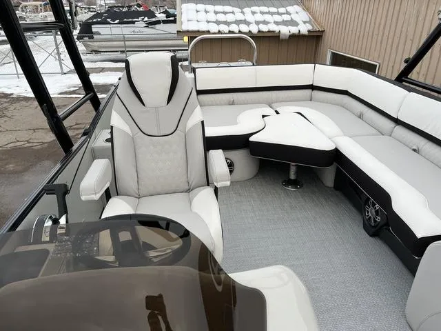 Slide: The Image of 2023 Avalon 25 Catalina Rear J Lounger boat interior with luxurious seating. - 9