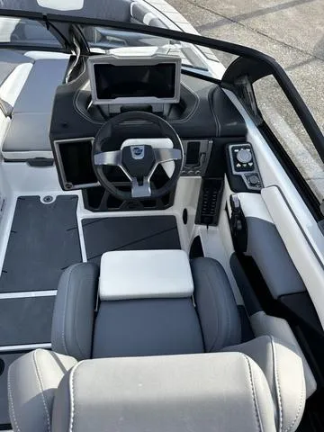 Slide: The Image of 2023 Malibu M240 boat interior with luxurious seating and modern design. - 5