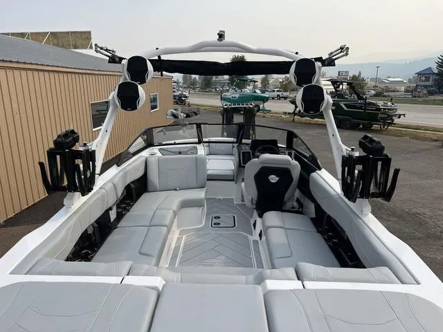 Slide: The Image of 2024 Malibu 23 LSV boat interior with spacious seating and advanced audio system. - 8