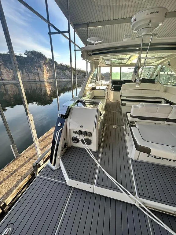 Slide: The Image of 2021 Formula 380 Super Sport Crossover boat interior with sleek design and spacious seating. - 10