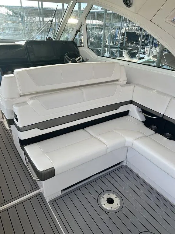 Slide: The Image of 2021 Formula 380 Super Sport Crossover interior with white seating and modern design. - 15