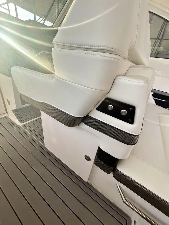 Slide: The Image of 2021 Formula 380 Super Sport Crossover interior with white leather seating and sleek design. - 19