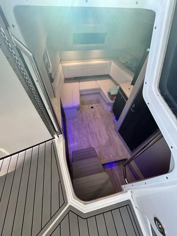 Slide: The Image of 2021 Formula 380 Super Sport Crossover interior with modern seating and ambient lighting. - 36