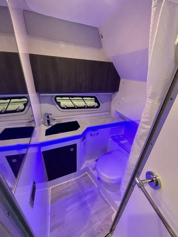 Slide: The Image of 2021 Formula 380 Super Sport Crossover bathroom with modern design and ambient lighting. - 45