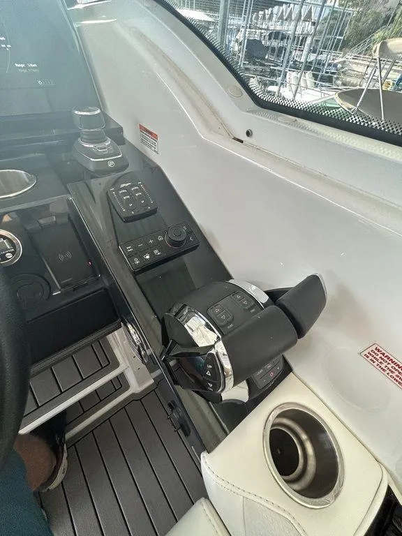 Slide: The Image of 2021 Formula 380 Super Sport Crossover helm with modern controls and cup holder. - 48