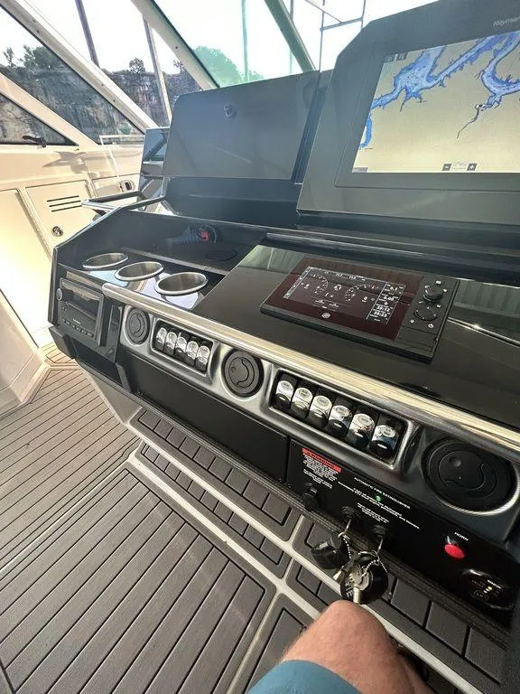 Slide: The Image of 2021 Formula 380 Super Sport Crossover helm with navigation display and controls. - 49