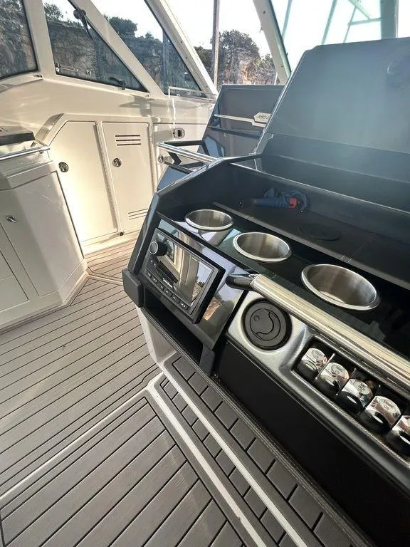 Slide: The Image of 2021 Formula 380 Super Sport Crossover boat interior with sleek kitchen amenities. - 50