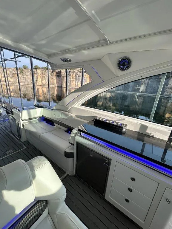 Slide: The Image of 2021 Formula 380 Super Sport Crossover yacht interior with sleek seating and modern design. - 52