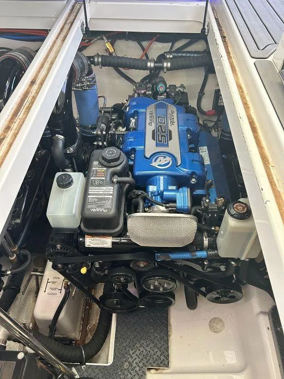 Slide: The Image of 2021 Formula 380 Super Sport Crossover engine compartment, showcasing a powerful marine engine. - 53