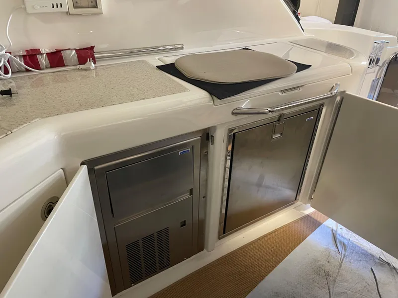 Slide: The Image of Sea Ray 540 Sundancer 2010 yacht kitchen with stainless steel appliances. - 11