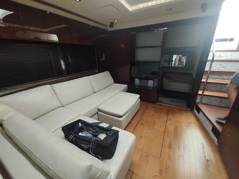 Slide: The Image of Luxurious interior of 2010 Sea Ray 540 Sundancer yacht with white leather sofa. - 13