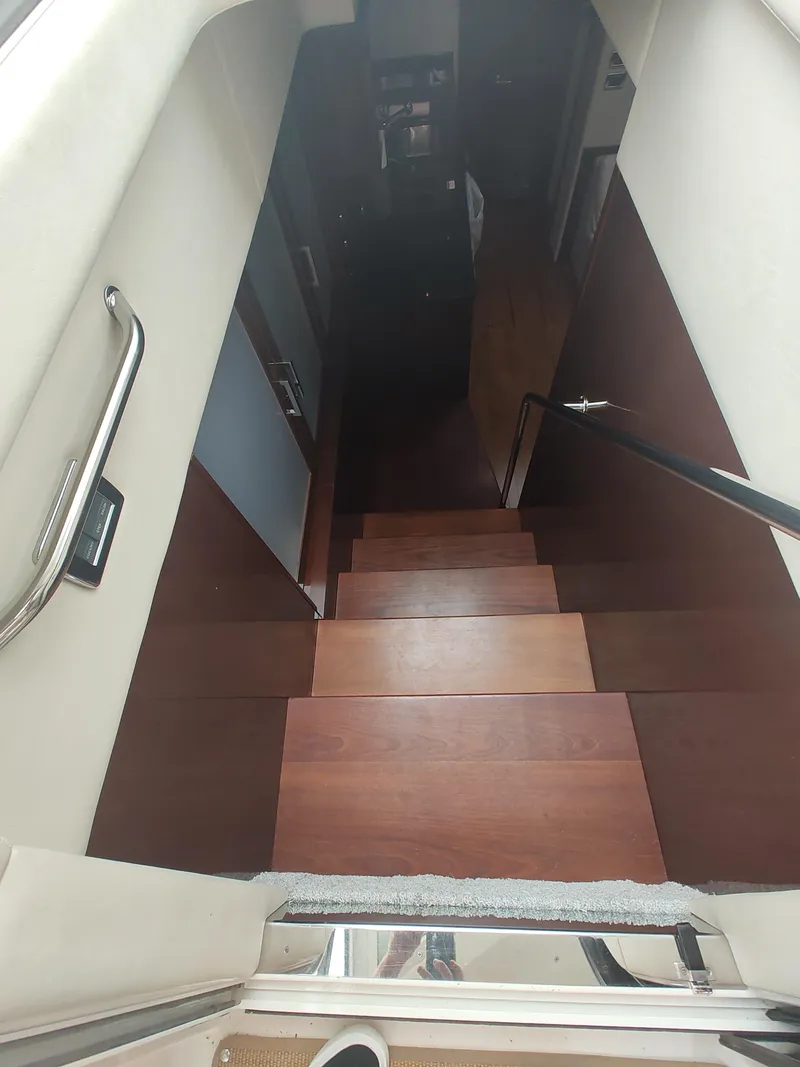 Slide: The Image of Interior stairs of 2010 Sea Ray 540 Sundancer yacht with wooden steps. - 16