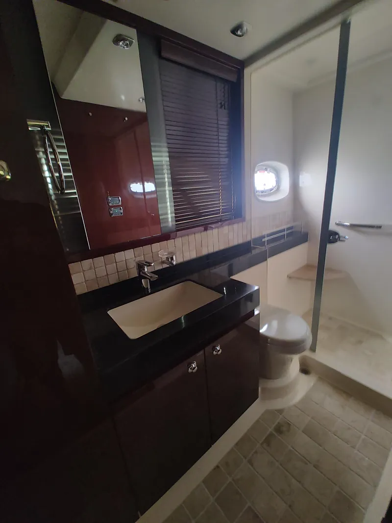 Slide: The Image of 2010 Sea Ray 540 Sundancer bathroom with modern fixtures and shower. - 17