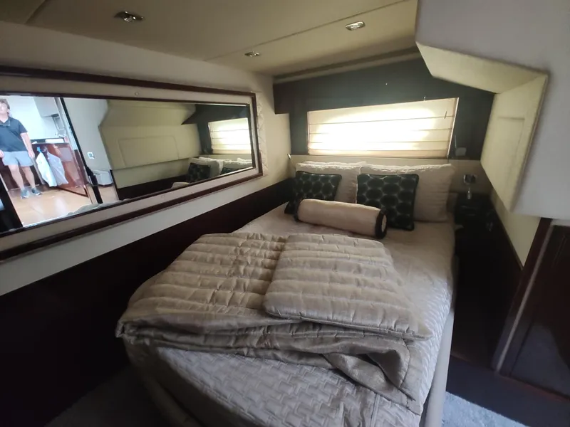 Slide: The Image of Luxurious bedroom interior of 2010 Sea Ray 540 Sundancer yacht with cozy bedding. - 20