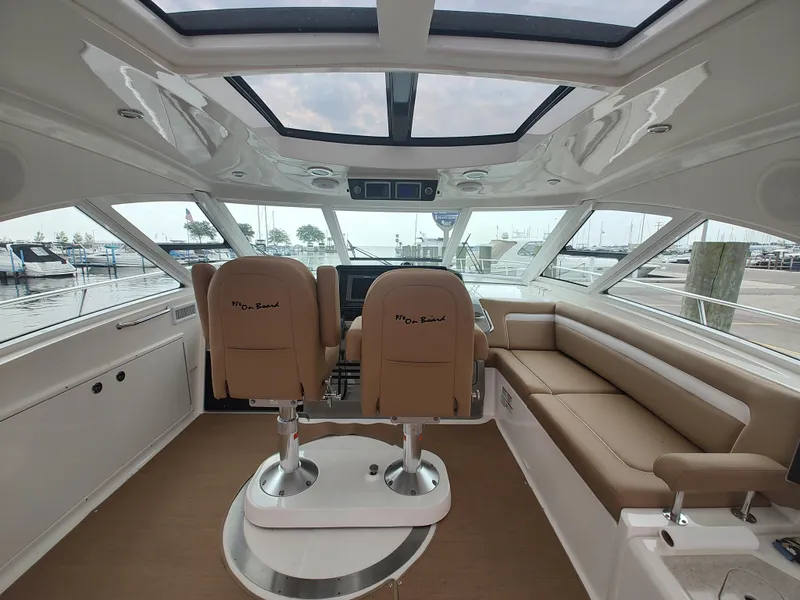 Slide: The Image of Interior of 2010 Sea Ray 540 Sundancer yacht with helm seats and panoramic windows. - 5