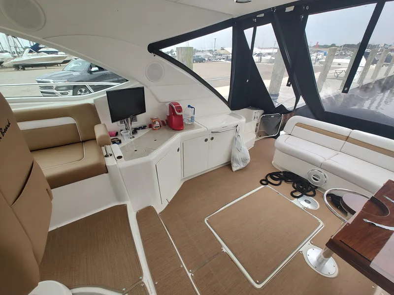 Slide: The Image of Interior of 2010 Sea Ray 540 Sundancer yacht with seating and entertainment area. - 9