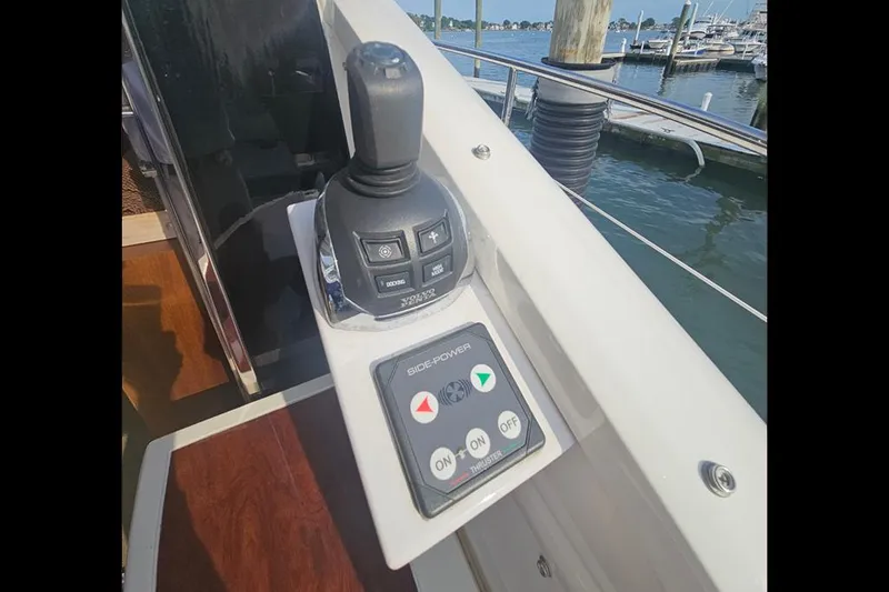 Slide: The Image of Fairline Targa 48 GT 2015 yacht control panel with joystick and buttons. - 11