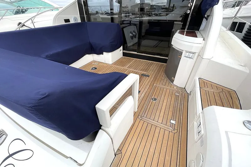 Slide: The Image of 2015 Fairline Targa 48 GT yacht with teak deck and covered seating area. - 16