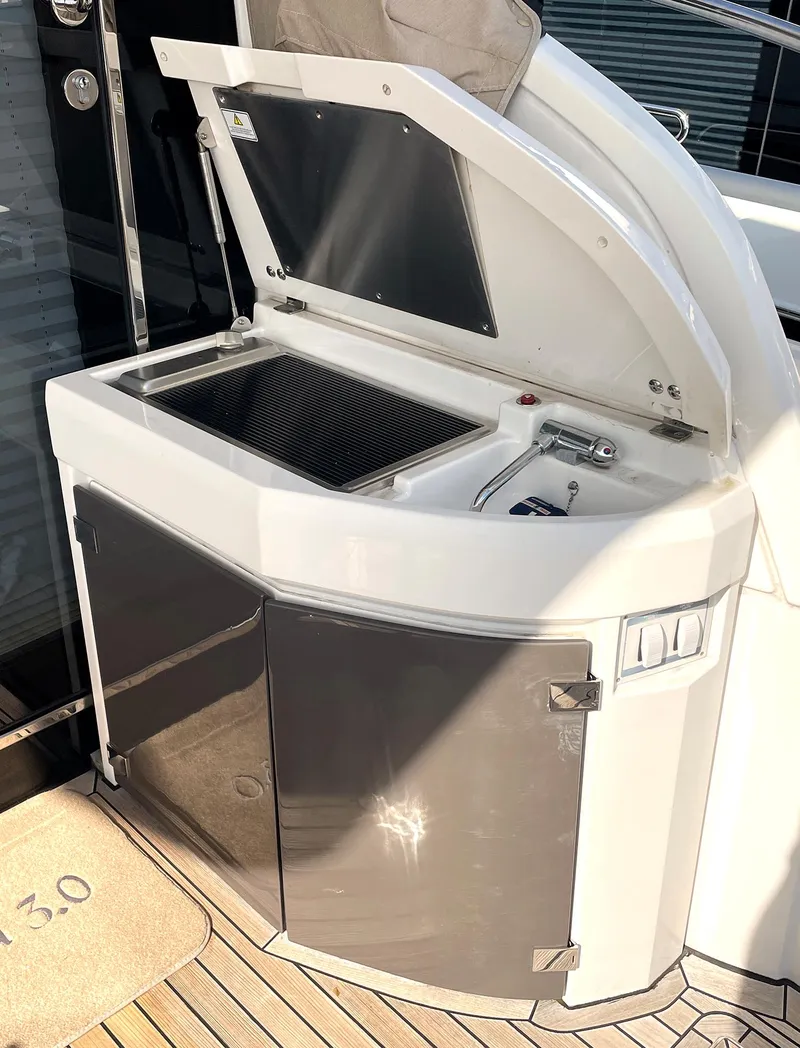 Slide: The Image of Outdoor kitchenette on a 2015 Fairline Targa 48 GT yacht. - 18