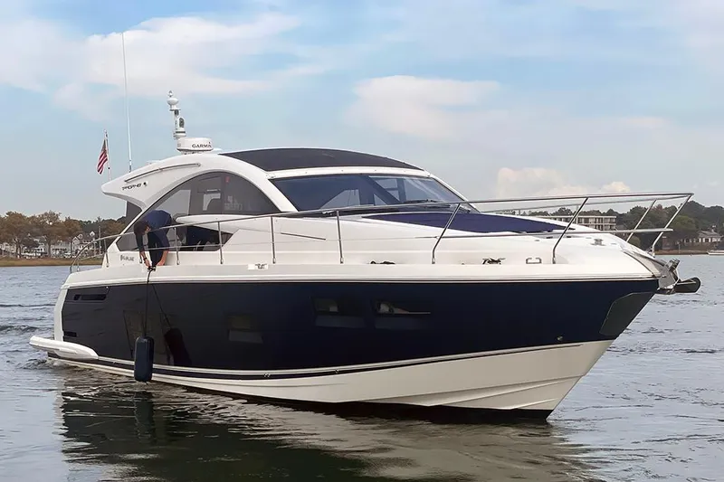 Slide: The Image of 2015 Fairline Targa 48 GT luxury yacht on calm water. - 2