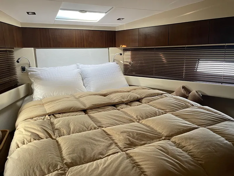 Slide: The Image of Luxurious bedroom in 2015 Fairline Targa 48 GT yacht with cozy bedding. - 25