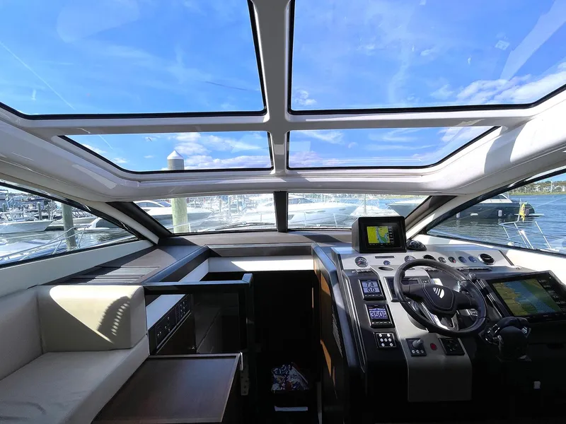 Slide: The Image of Interior cockpit view of 2015 Fairline Targa 48 GT yacht with panoramic windows. - 5