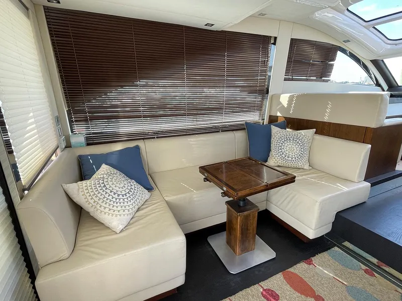 Slide: The Image of Luxurious interior of 2015 Fairline Targa 48 GT with beige leather seating and wooden table. - 9