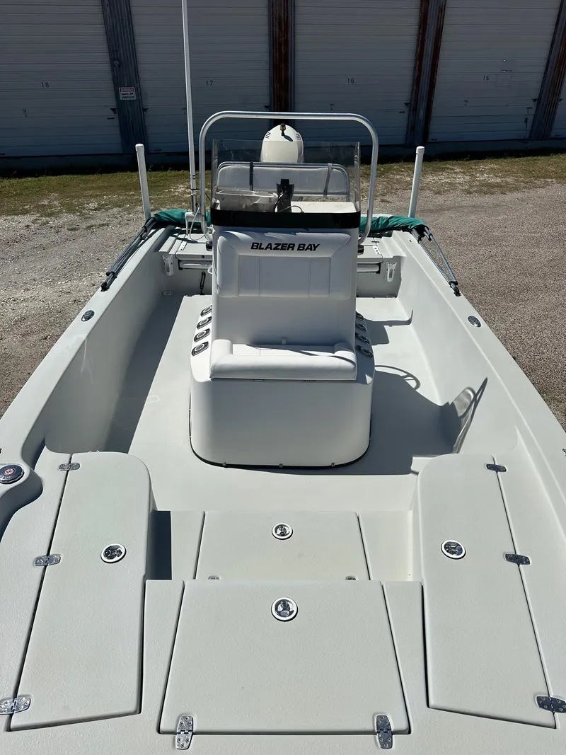 Slide: The Image of 2015 Blazer 2220 Bay boat with center console and storage compartments. - 4