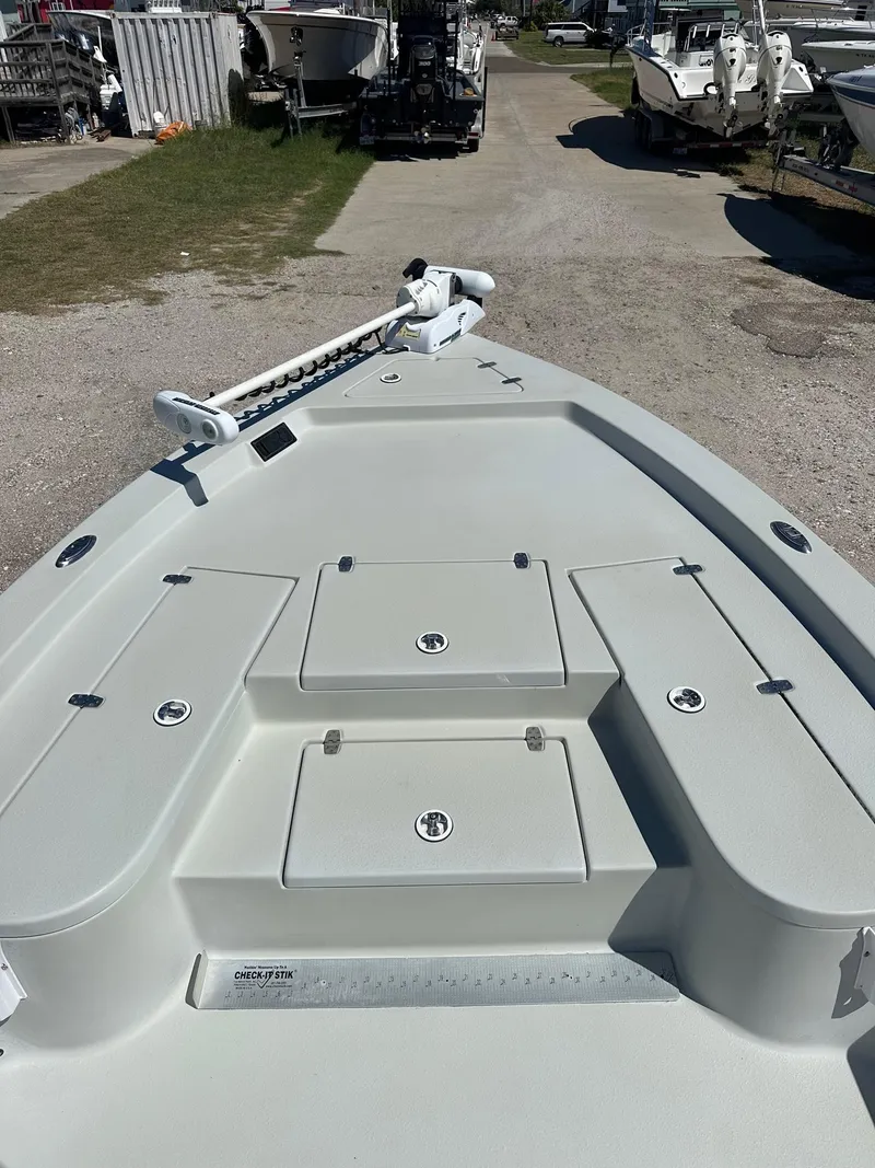 Slide: The Image of 2015 Blazer 2220 boat deck with storage compartments and trolling motor. - 5