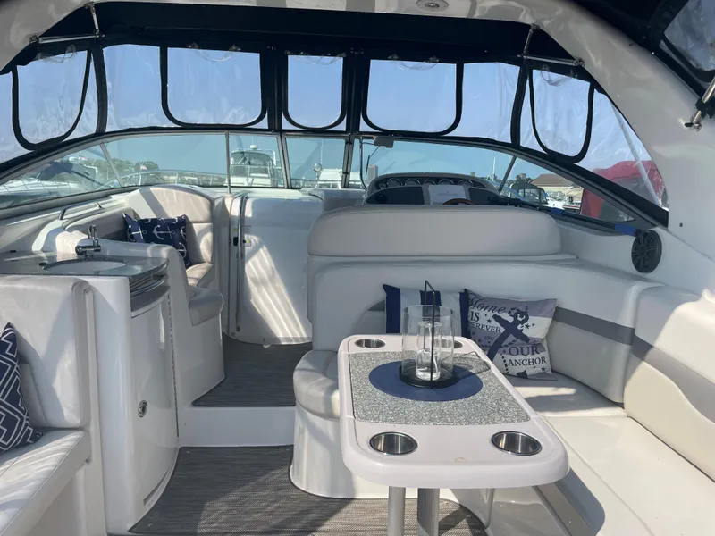 Slide: The Image of Interior of 2007 Chaparral 330 Signature boat with seating and table. - 10
