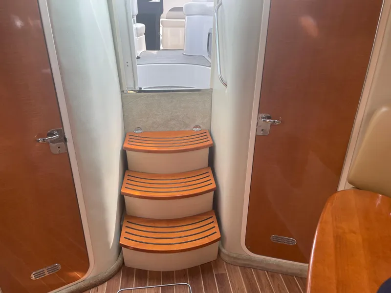 Slide: The Image of Interior stairs of 2007 Chaparral 330 Signature boat with wooden steps. - 23
