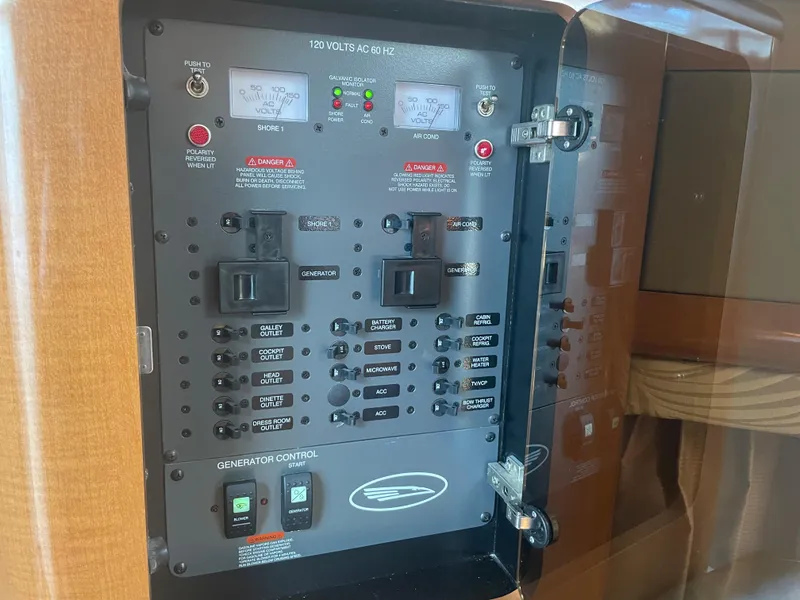 Slide: The Image of Electrical control panel on a 2007 Chaparral 330 Signature boat. - 33