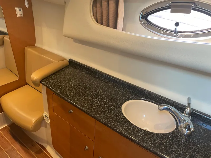 Slide: The Image of 2007 Chaparral 330 Signature boat interior with sink and seating area. - 35