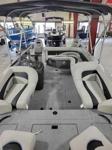 Slide: The Image of 2023 Lowe SD 224 boat interior with spacious seating and canopy. - 11