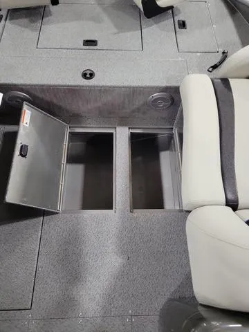 Slide: The Image of 2023 Lowe SD 224 boat with open storage compartments and seating. - 8