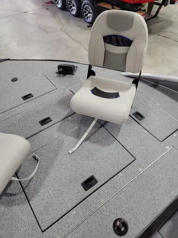 Slide: The Image of 2023 Lowe SD 224 boat interior with seating and storage compartments. - 9