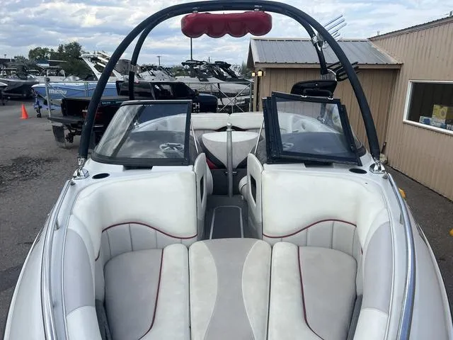 Slide: The Image of 2005 Malibu Sunsetter LXi boat interior with white and gray seating. - 3