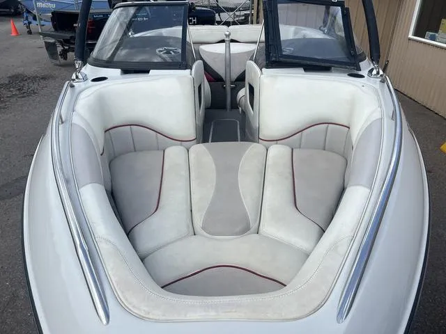 Slide: The Image of 2005 Malibu Sunsetter LXi boat interior with white and gray seating. - 4