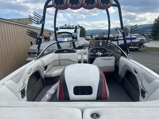 Slide: The Image of 2005 Malibu Sunsetter LXi boat interior with seating and wakeboard tower. - 7