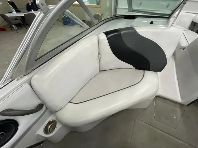 Slide: The Image of 2006 Moomba Outback boat interior with white and black seating. - 10