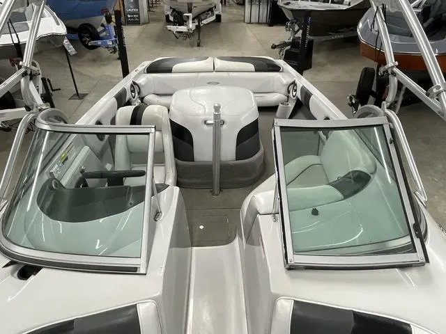 Slide: The Image of 2006 Moomba Outback boat interior with open windshield and seating area. - 13