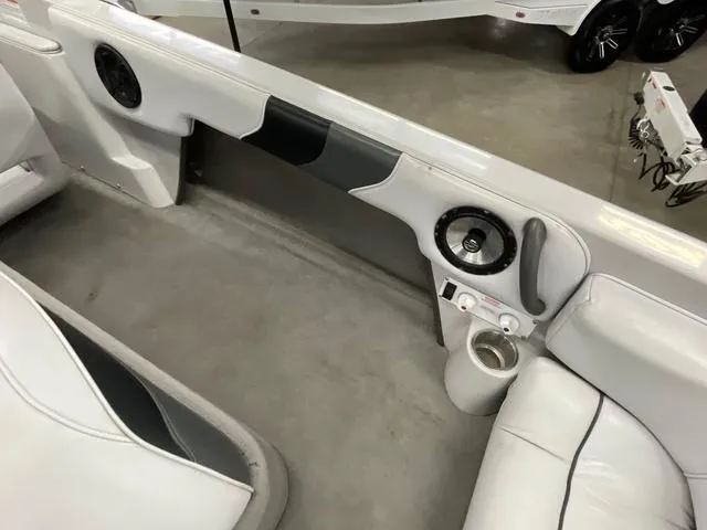 Slide: The Image of 2006 Moomba Outback boat interior with white seating and speaker system. - 14