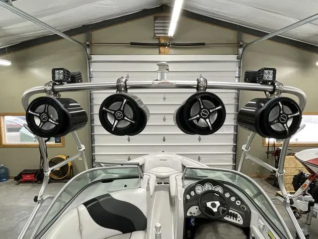 Slide: The Image of 2006 Moomba Outback boat interior with mounted speakers and control panel. - 16