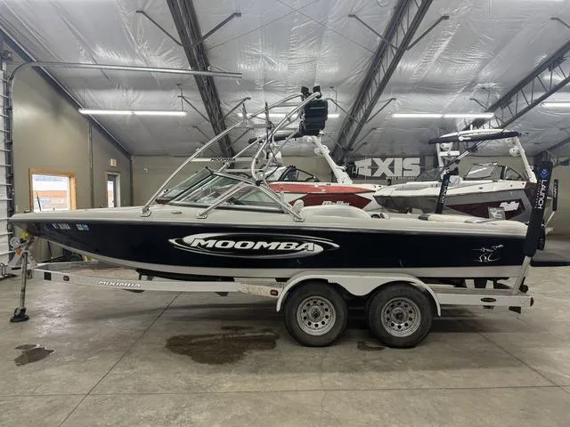 Slide: The Image of 2006 Moomba Outback boat on trailer in indoor storage facility. - 17