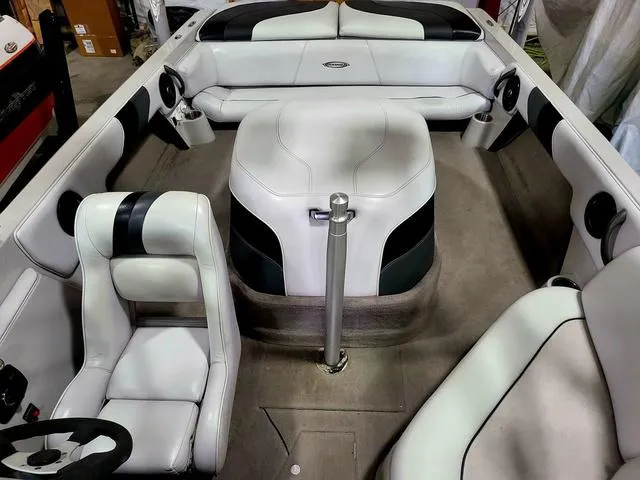 Slide: The Image of 2006 Moomba Outback boat interior with white and black seating. - 3