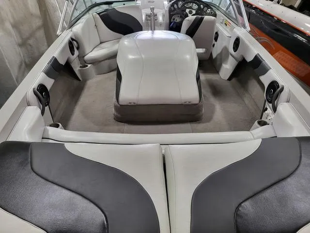 Slide: The Image of 2006 Moomba Outback boat interior with white and black seating and dashboard. - 5