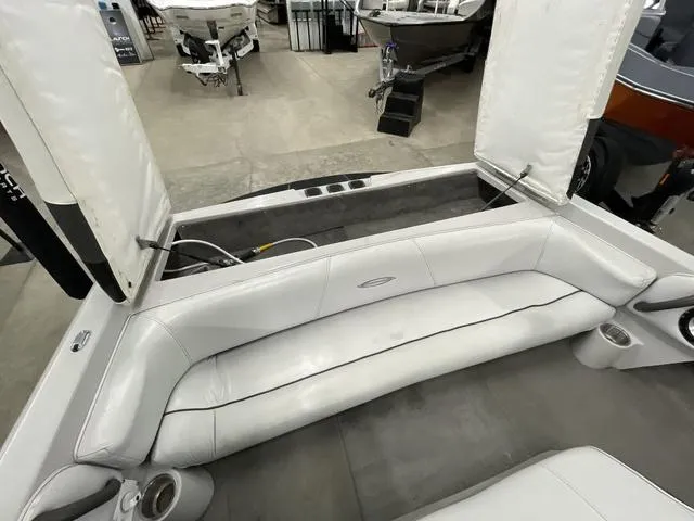 Slide: The Image of 2006 Moomba Outback boat interior with white seating and storage compartments. - 8