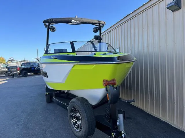 Slide: The Image of 2024 Malibu 22 LSV boat in bright green on a trailer. - 11
