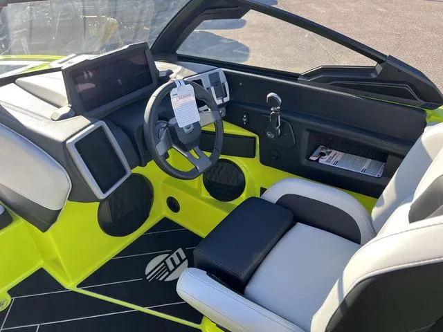 Slide: The Image of 2024 Malibu 22 LSV boat interior with modern dashboard and steering wheel. - 4