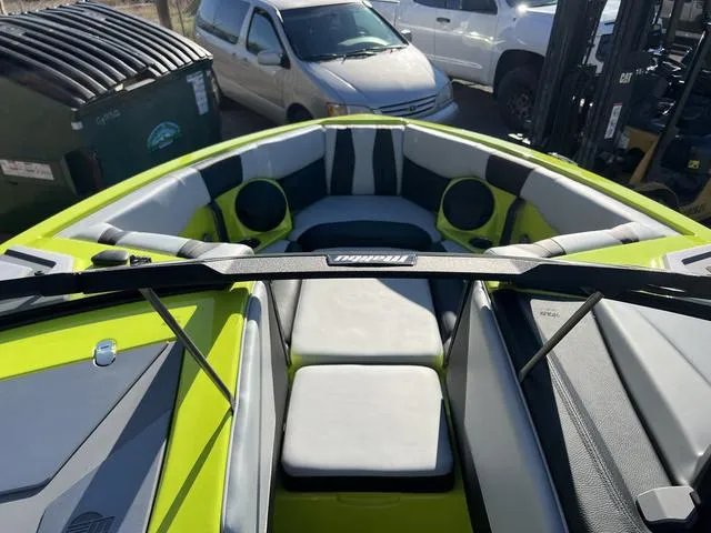 Slide: The Image of 2024 Malibu 22 LSV boat interior with lime green and gray seating. - 5